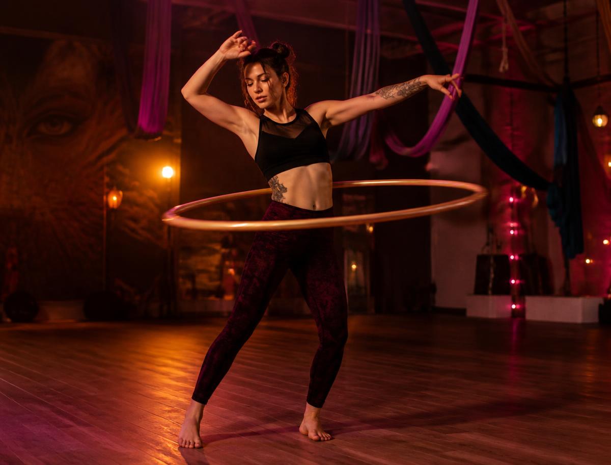 Dancer spinning a hula hoop during a circus flow arts class in Chester, NY